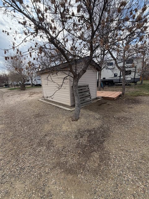 After the spring cleanup: Gravel pad behind the shed