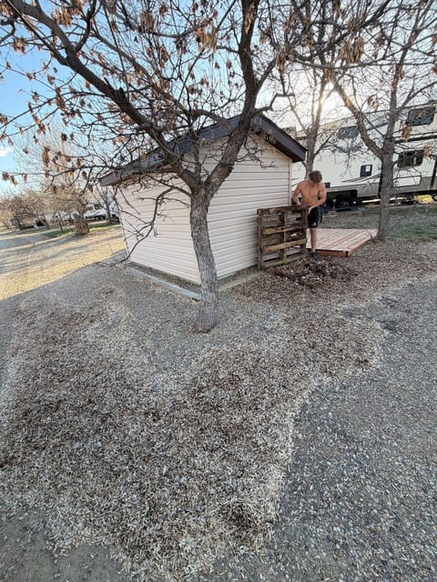 Before the spring cleanup: Gravel pad behind the shed