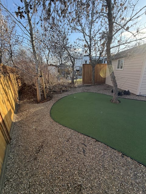Putting green and raked gravel after a spring cleanup at Saskatchewan Landing